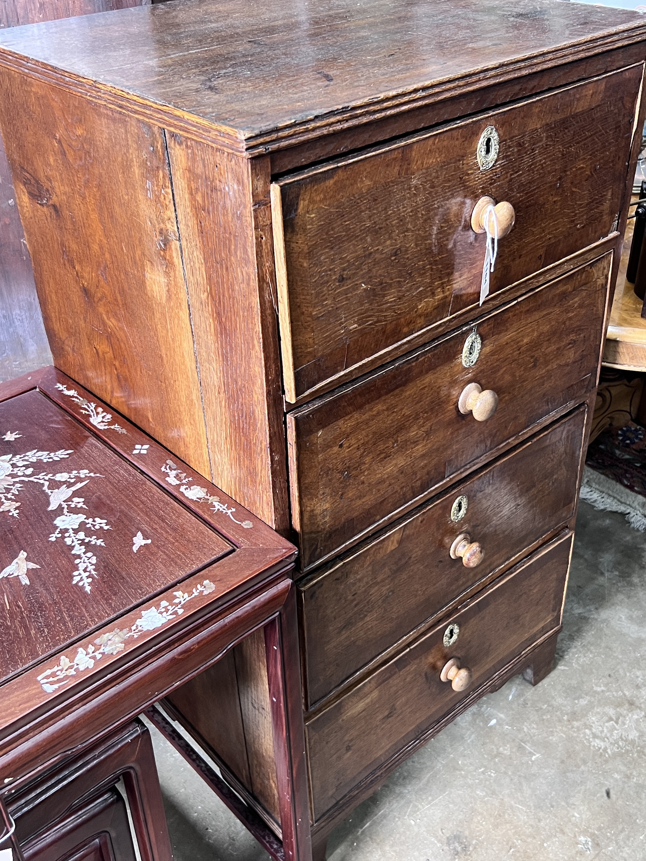 An early 19th century narrow oak four drawer chest, width 59cm, depth 48cm, height 106cm